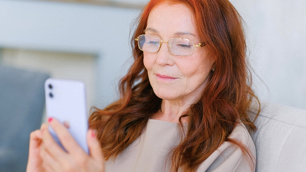 older woman on phone for ringless voice message
